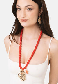 Collana lunga con sfere rosse in acrilico e pendente polipetto in metallo Rosso