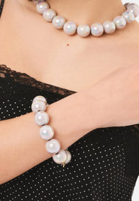 Bracciale elastico con sfere lucide in acrilico grigie Grigio